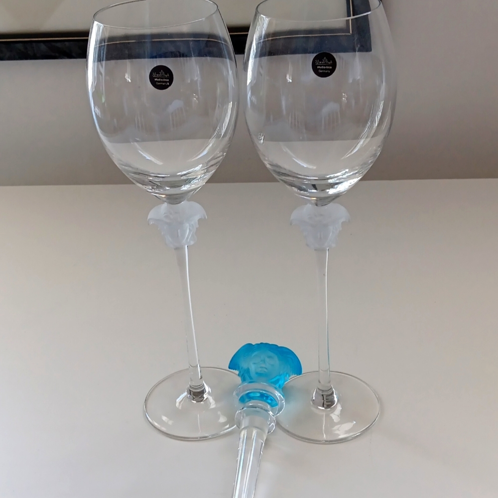 Vintage Medusa Lumiere wine glasses and bottle stopper.